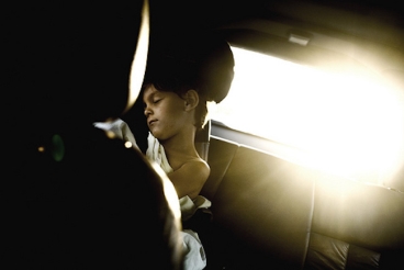 A Child Sleeping in the Backseat of a Car