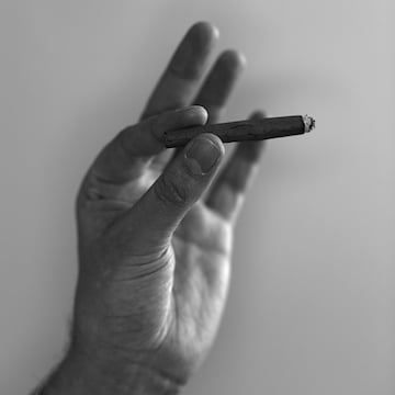 Hand Holding a Marijuana Cigarette